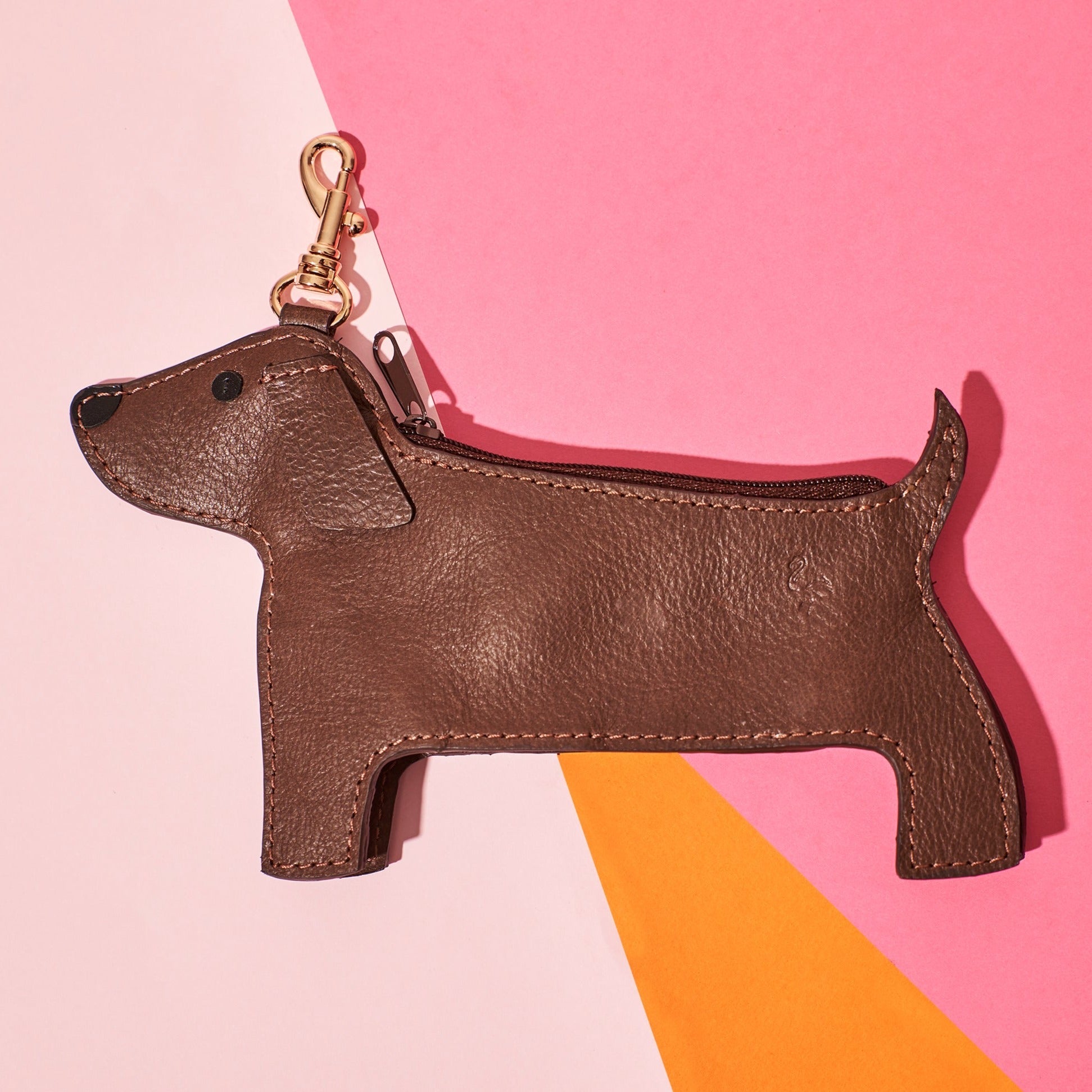 Wicker Darling's Salami dachshund coin purse on a colourful background