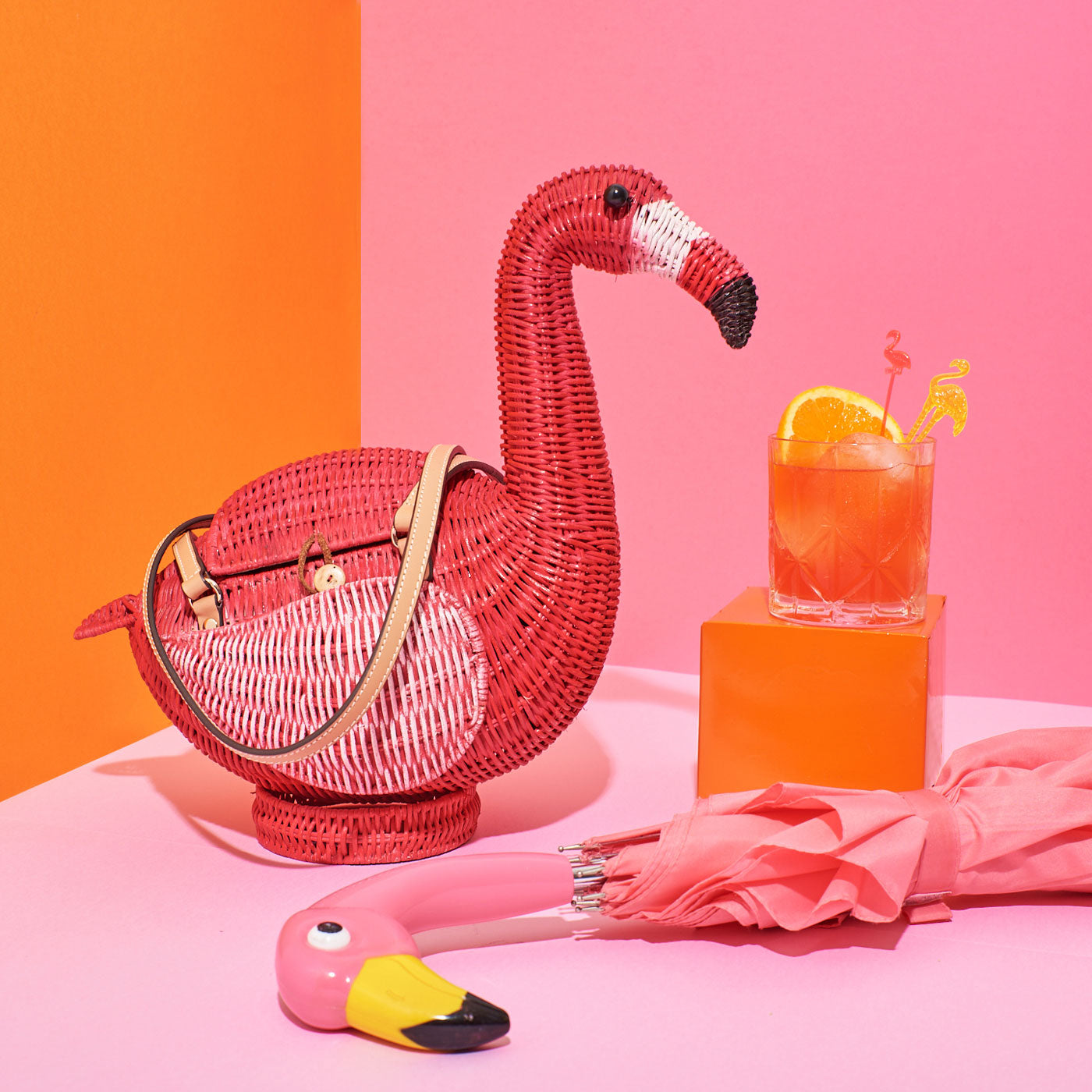 Flamingo Montoya (Monty) the Flamingo Wicker Darling bag on a colourful background