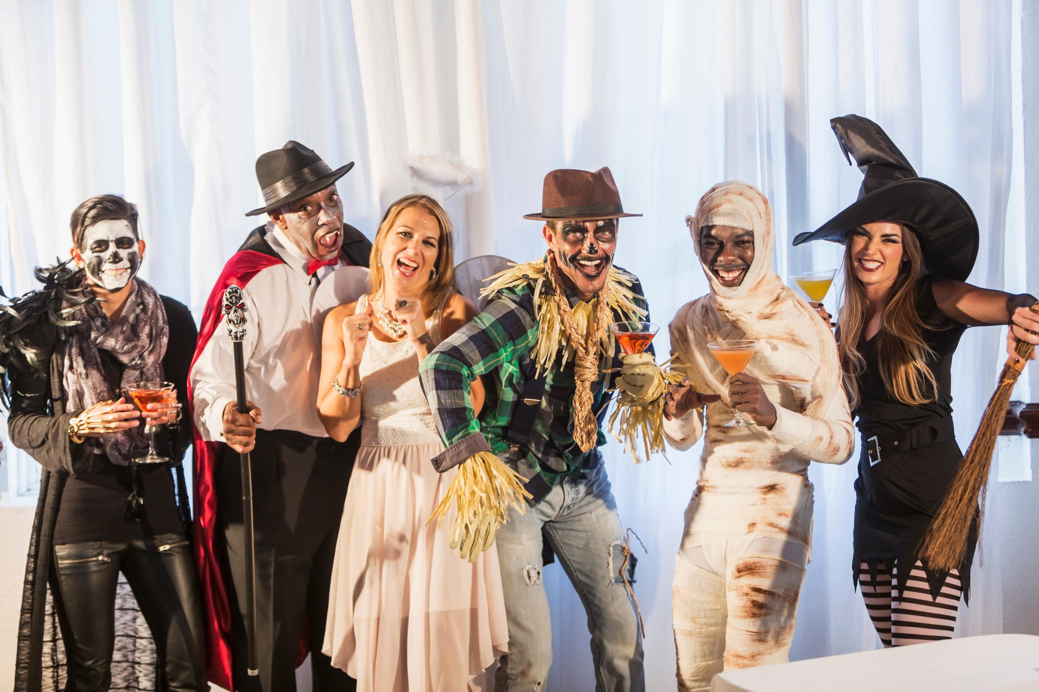 Adults wearing Halloween costume during a Halloween party