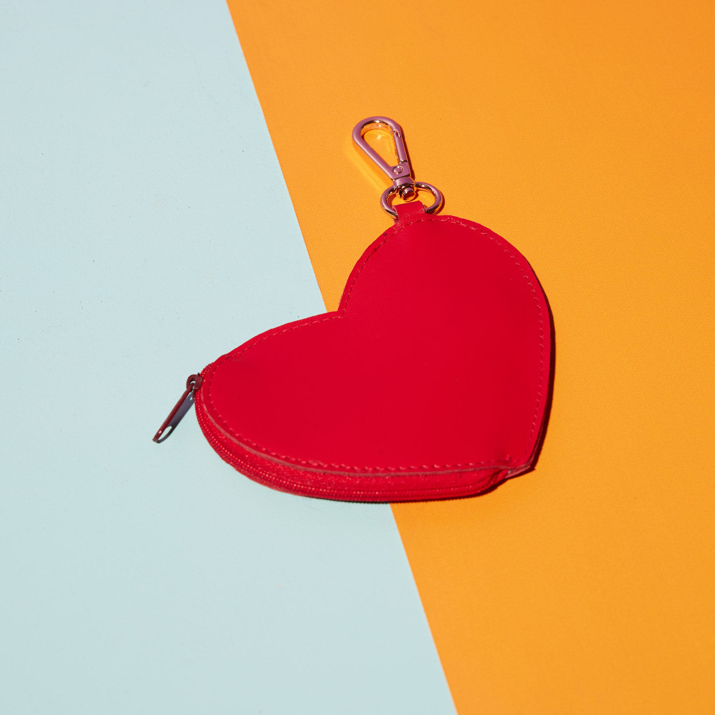 Wicker Darling's Heart coin purse on a colourful background