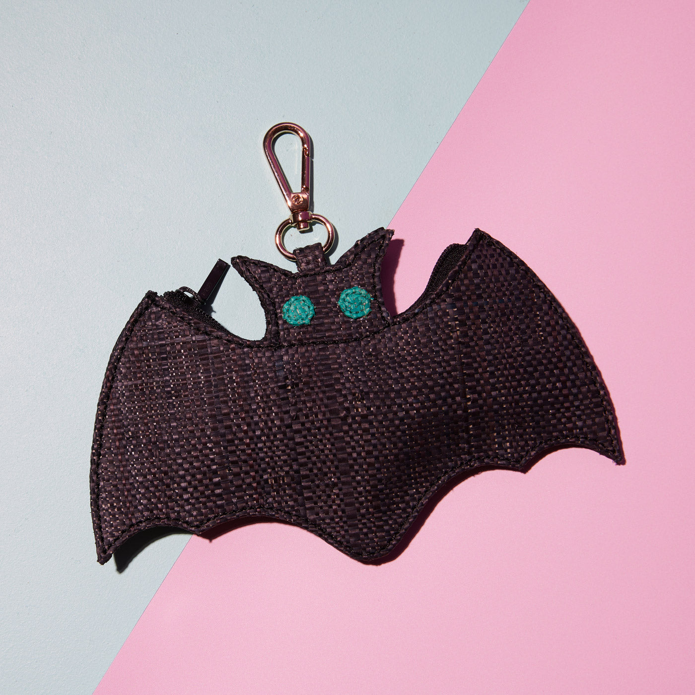 Wicker Darling's Batholomew Jnr. the bat coin purse on a colourful background