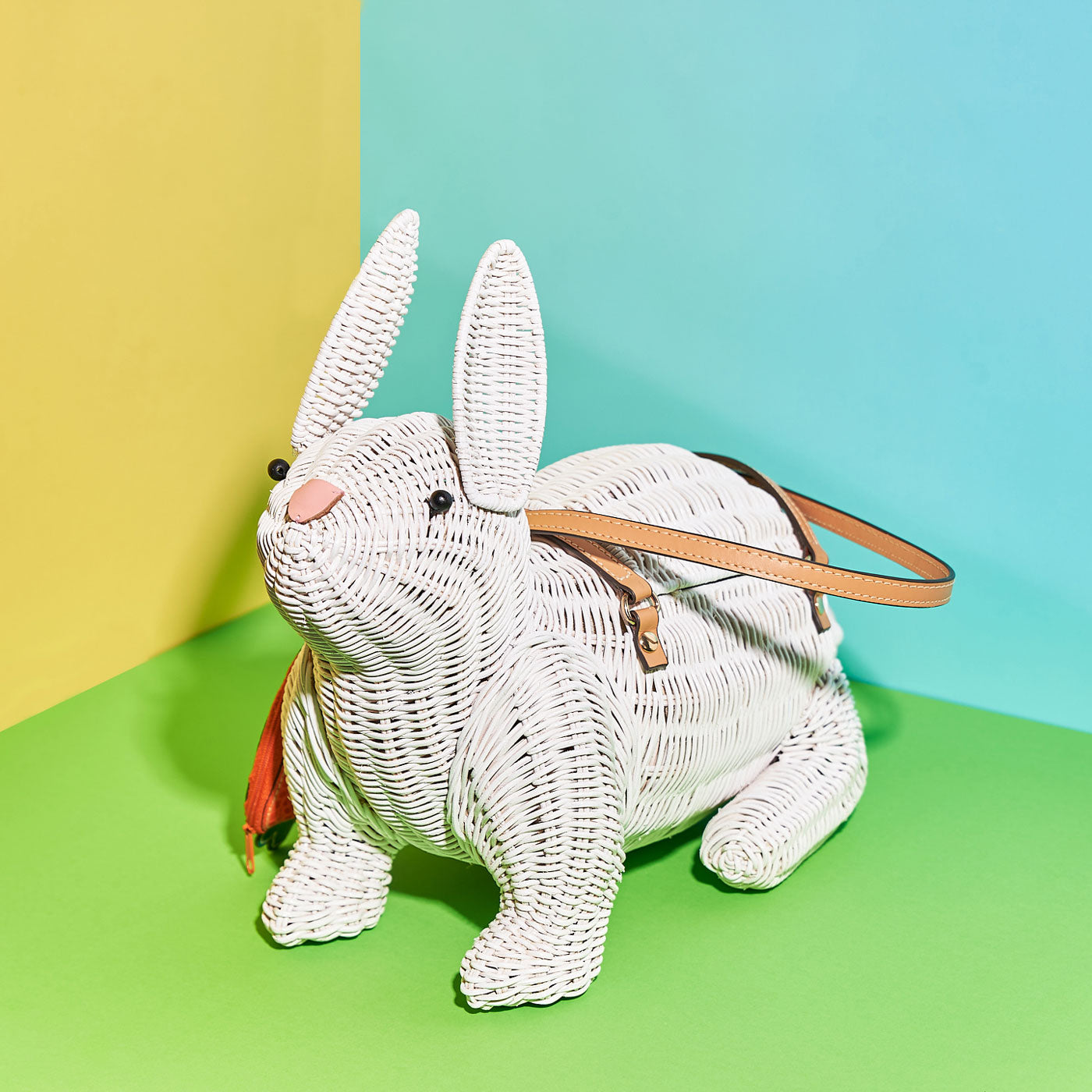 Wicker Darling's Harvey the white rabbit purse on a vibrant background