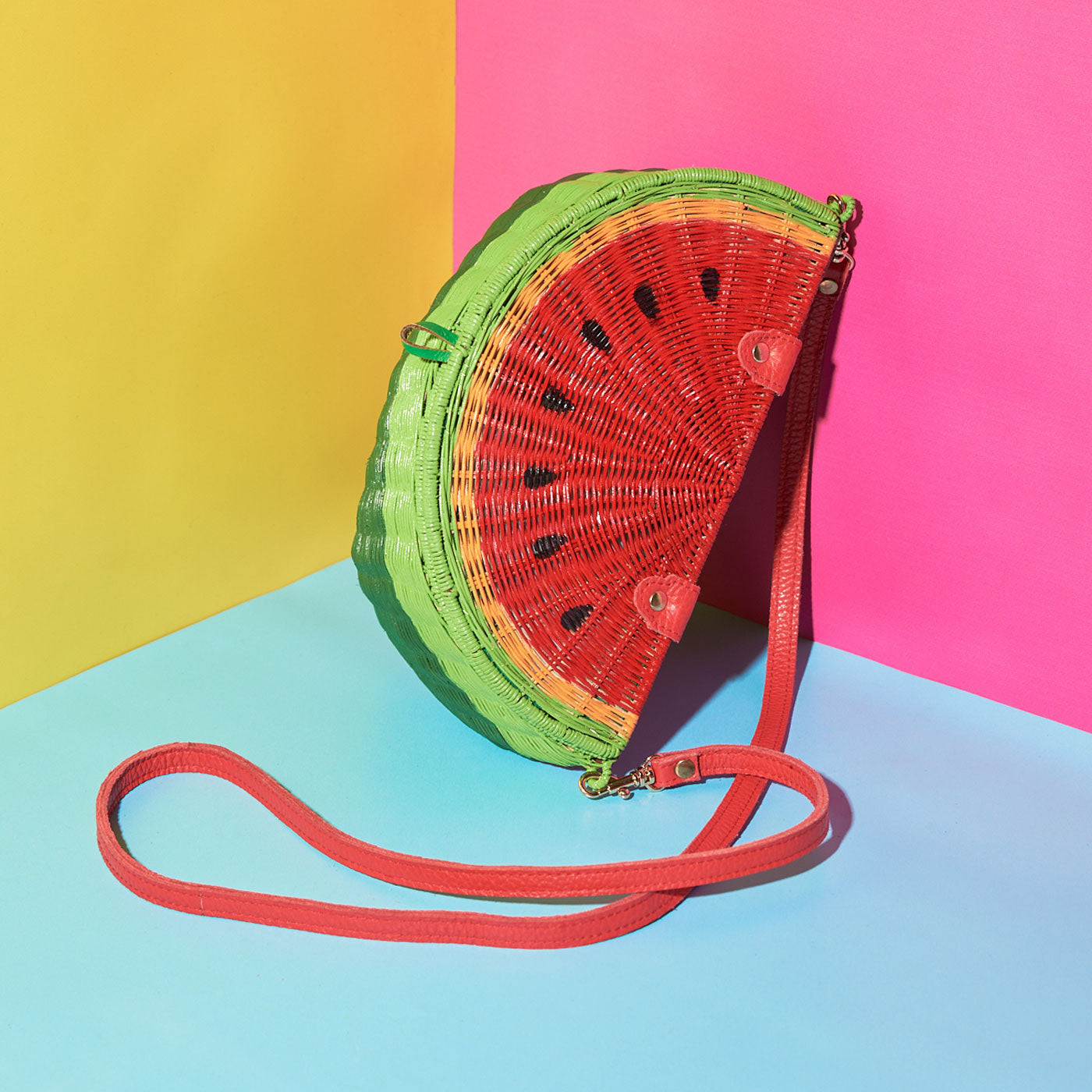 Watermelon satchel from Wicker Darling on a colourful background