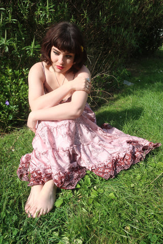 photo of model wearing pink floral pattern Delilah tiered elasticated maxi dress by all about audrey