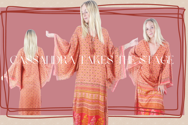 image of UK size 12 model wearing Cassandra boho maxi kaftan dress with wide split seam square sleeves and leg slit handmade from recycled 70s vintage Indian sari in Coral Pink & Gold Crest Floral size S/M by all about audrey