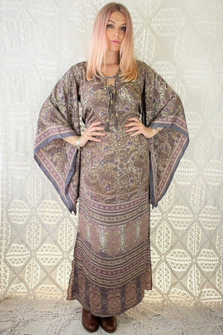 model wears cassidy bohemian maxi dress with kimono sleeves kaftan style dress in lilac purple pansy paisley print colour by all about audrey