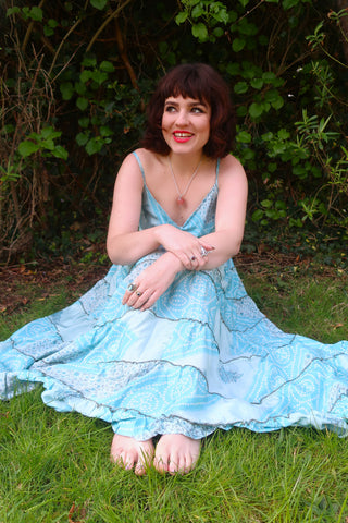 photo of model wearing blue floral pattern Delilah tiered elasticated maxi dress by all about audrey