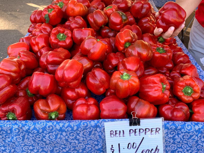 A Table of red Bell Peppers at The Farmers Market in Chico, CA