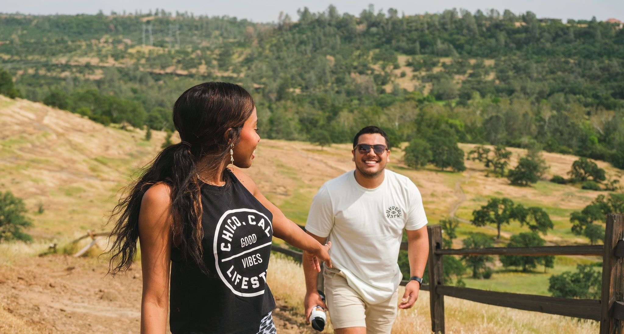 a man and a woman hiking in bidwell park.