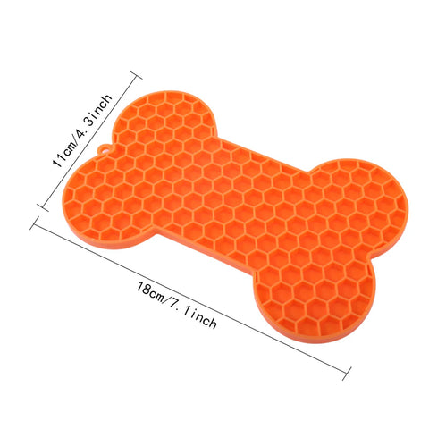 Tapis à lécher forme d'os pour chien orange