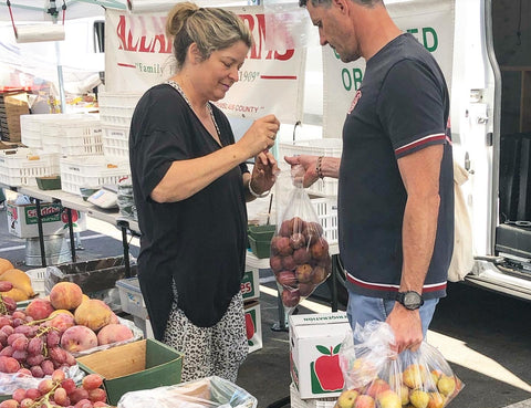 Francois Bonjour Bakehouse Owner Getting Organic Fruits from Alice Allard at the Farmers Market in San Mateo