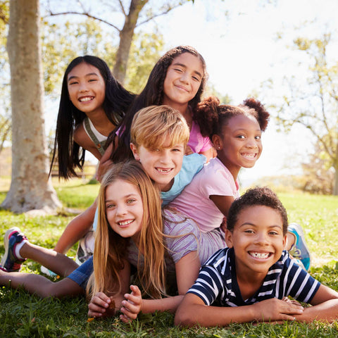 friends posing for a picture outside