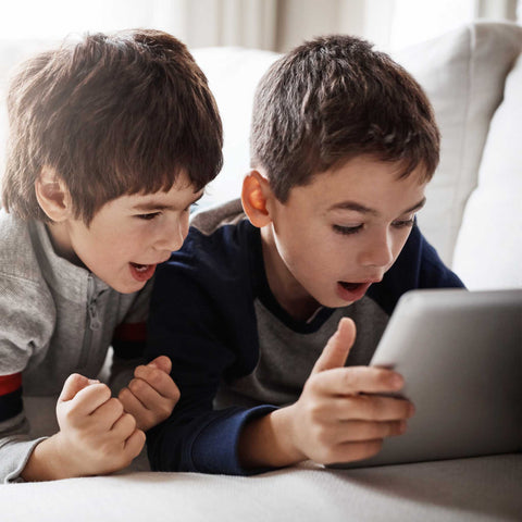 kids playing on a tablet
