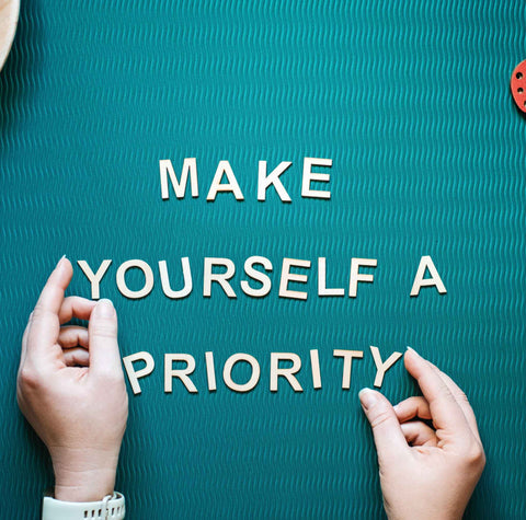 sign that reads: make yourself a priority