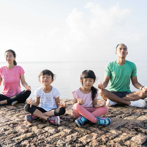 family meditating