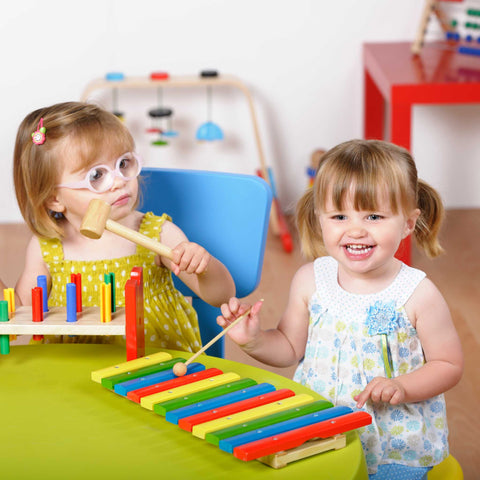 kids playing with toy musical instruments