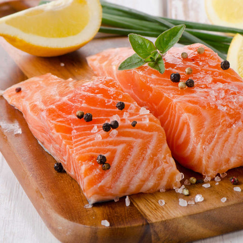 salmon pieces on cutting board