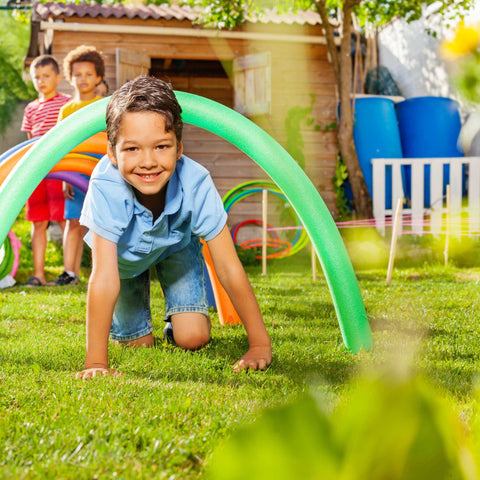 kids going through obstacle course tunnel