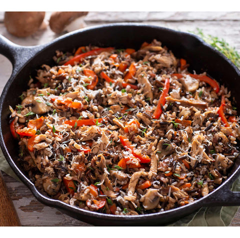 beef, chicken, and vegetables in skillet
