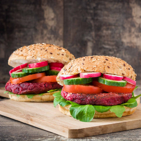 veggie burgers on a cutting board
