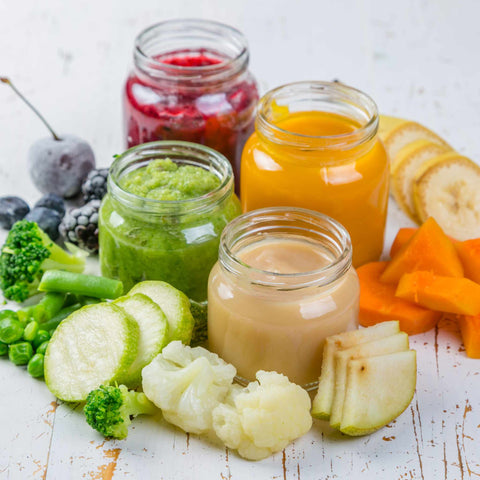 colorful fruit and vegetable purees in glass jars