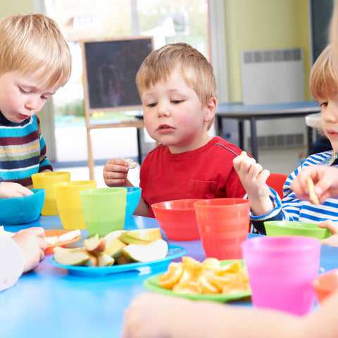 kids eating fruit at the table