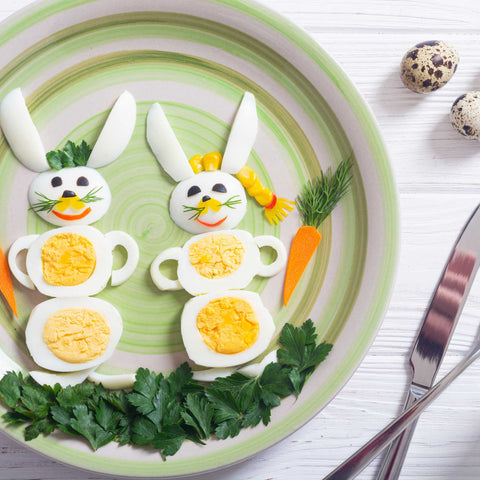 creative, decorative eggs and vegetables on a plate
