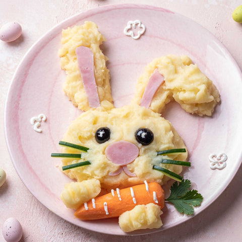 creative presentation of eggs and ham in shape of bunny