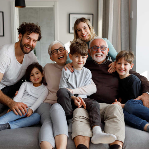 multi-generational family sitting on the couch