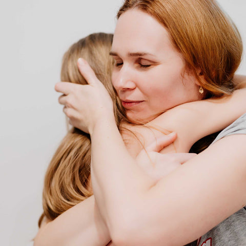 mom hugging child