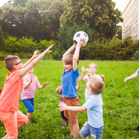 kids playing soccer outside