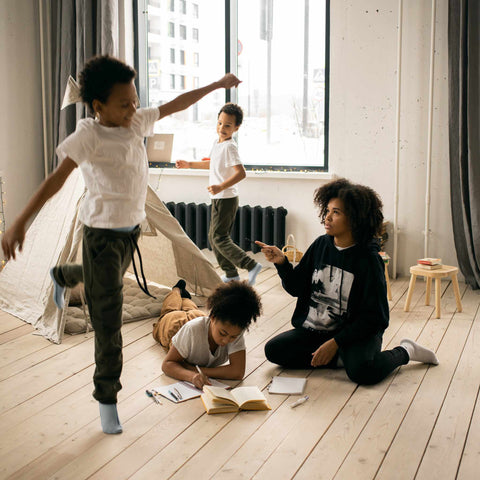 mom and kids playing on floor