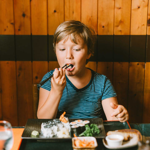 kid eating at table