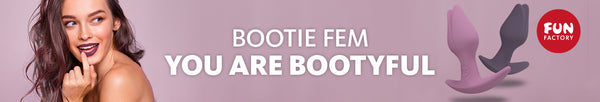 Promotional banner for the Fun Factory Bootie Fem. One side of the banner shows a person in lipstick smiling while the opposing side shows both of the Bootie Fem toys next to one another. The text in the middle reads "Bootie Fem. You are bootyful" | Kinkly Shop