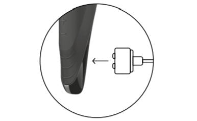 Illustrated image shows the base of the Satisfyer Men Wand. To the right of the Men Wand, the illustrated charging cable tip is shown. An arrow shows to place the charging cable on top of the charging port on the base of the Men Wand. | Kinkly Shop