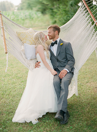 bride-and-groom-kissing-on-a-hammock