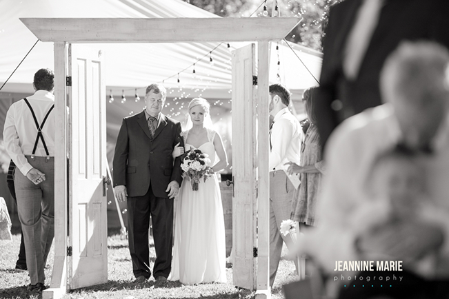 bride waiting to walk down the aisle with her dad 