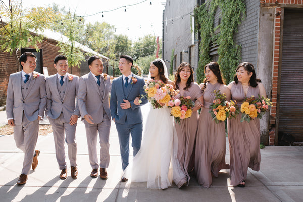 Bridal Party strolling together down a sidewalk.