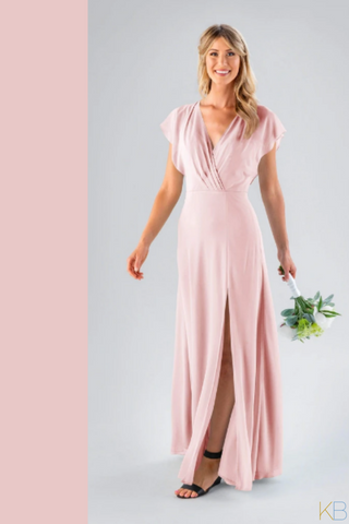 Model in Kennedy Blue Bridesmaid Dress "Ava" in color 'Blush Pink'.
