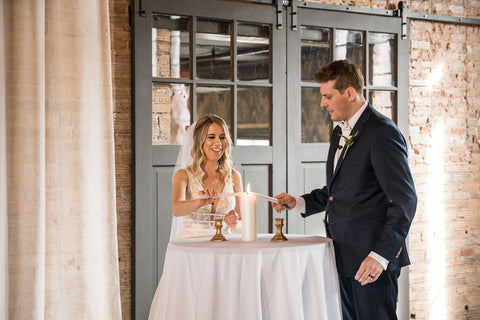 Bride and Groom lighting a candle during their unity ceremony.