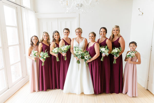 Bride and Bridesmaids and Junior Bridesmaids gathered together for a photo.