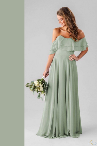 Model in Kennedy Blue Bridesmaid Dress "Allison" in color 'Sage Green'.