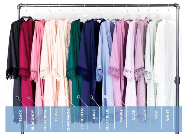 Kennedy Blue Satin and Lace Bridesmaid Robes hung up showing many robe colors. 