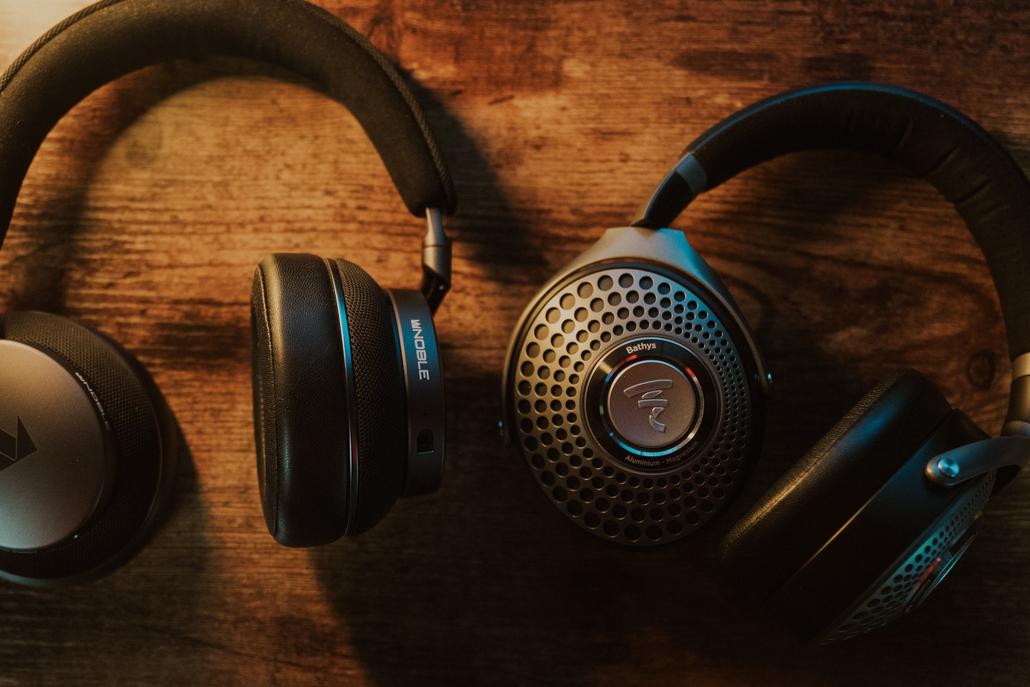 Noble FoKus Apollo and Focal Bathys on a wooden desk side by side from the Bloom Audio Gallery