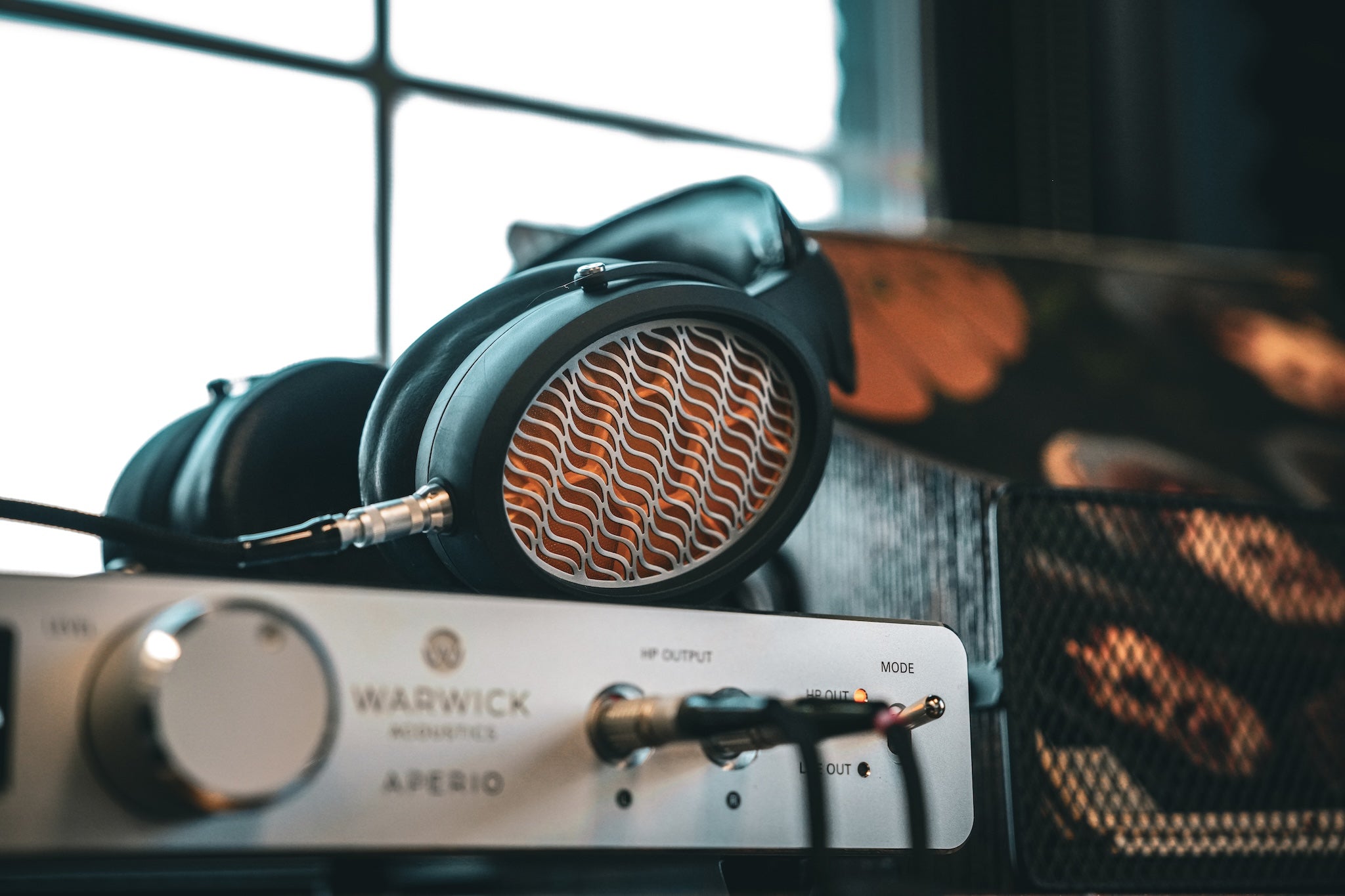 Warwick Aperio black headphone on top silver amp dramatic focus