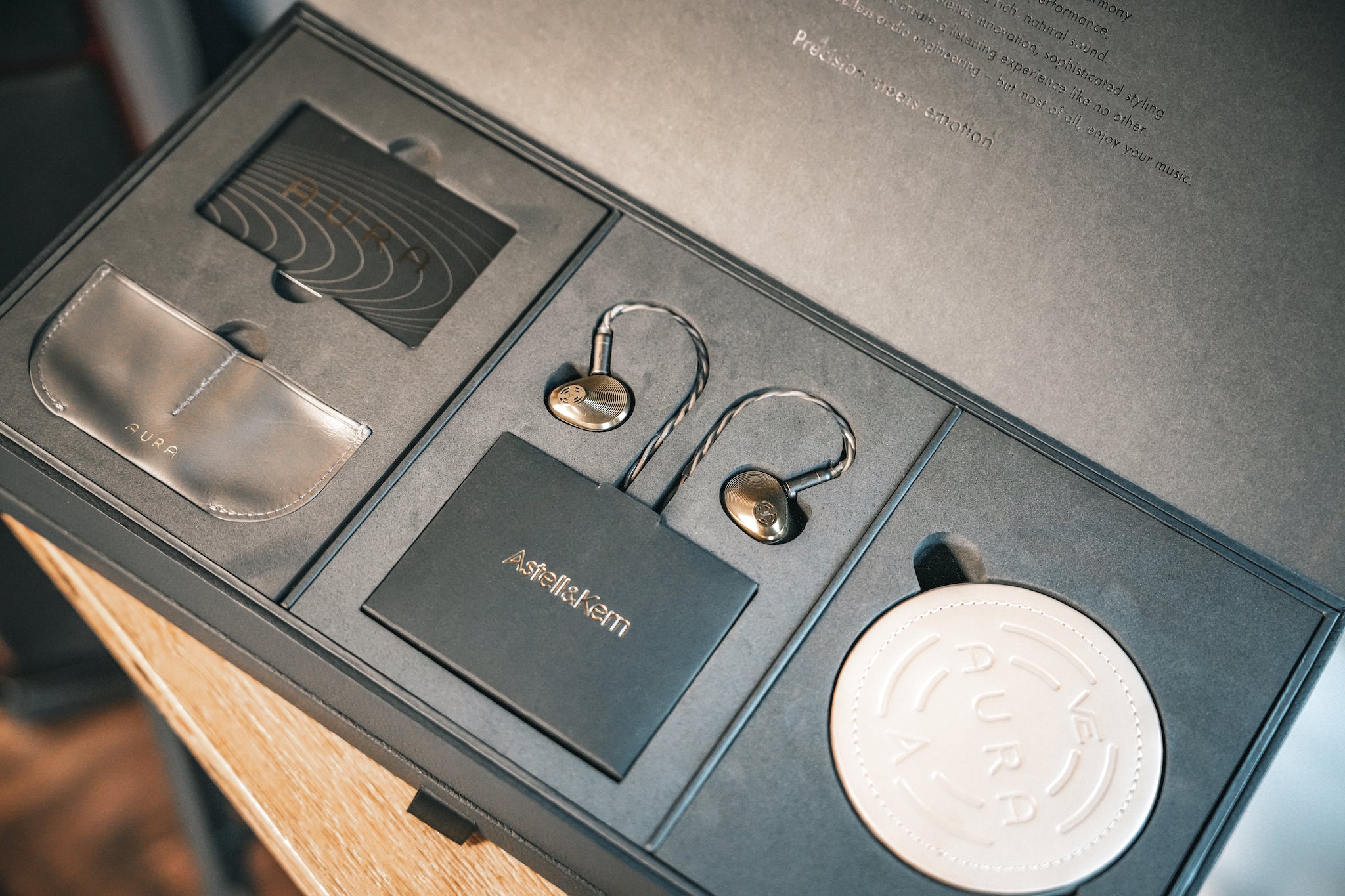 Astell&Kern Vision Ears Aura retail package with open lid revealing accessories and earphones