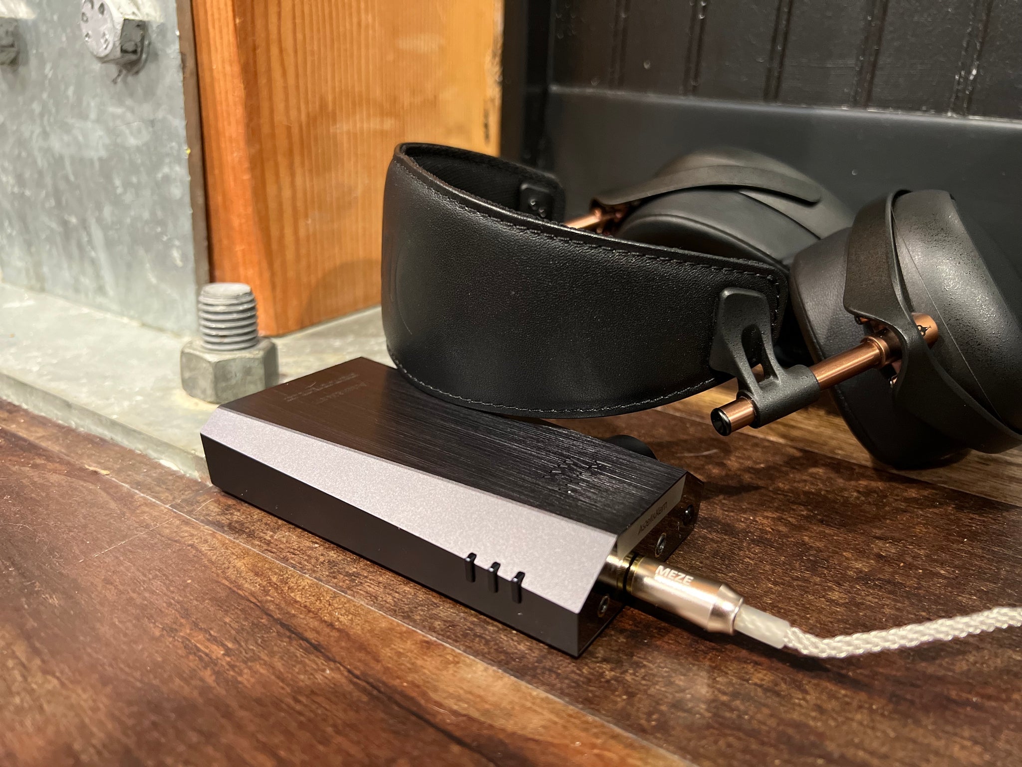 Astell&Kern KANN Max withy connected Meze Liric on wood floor