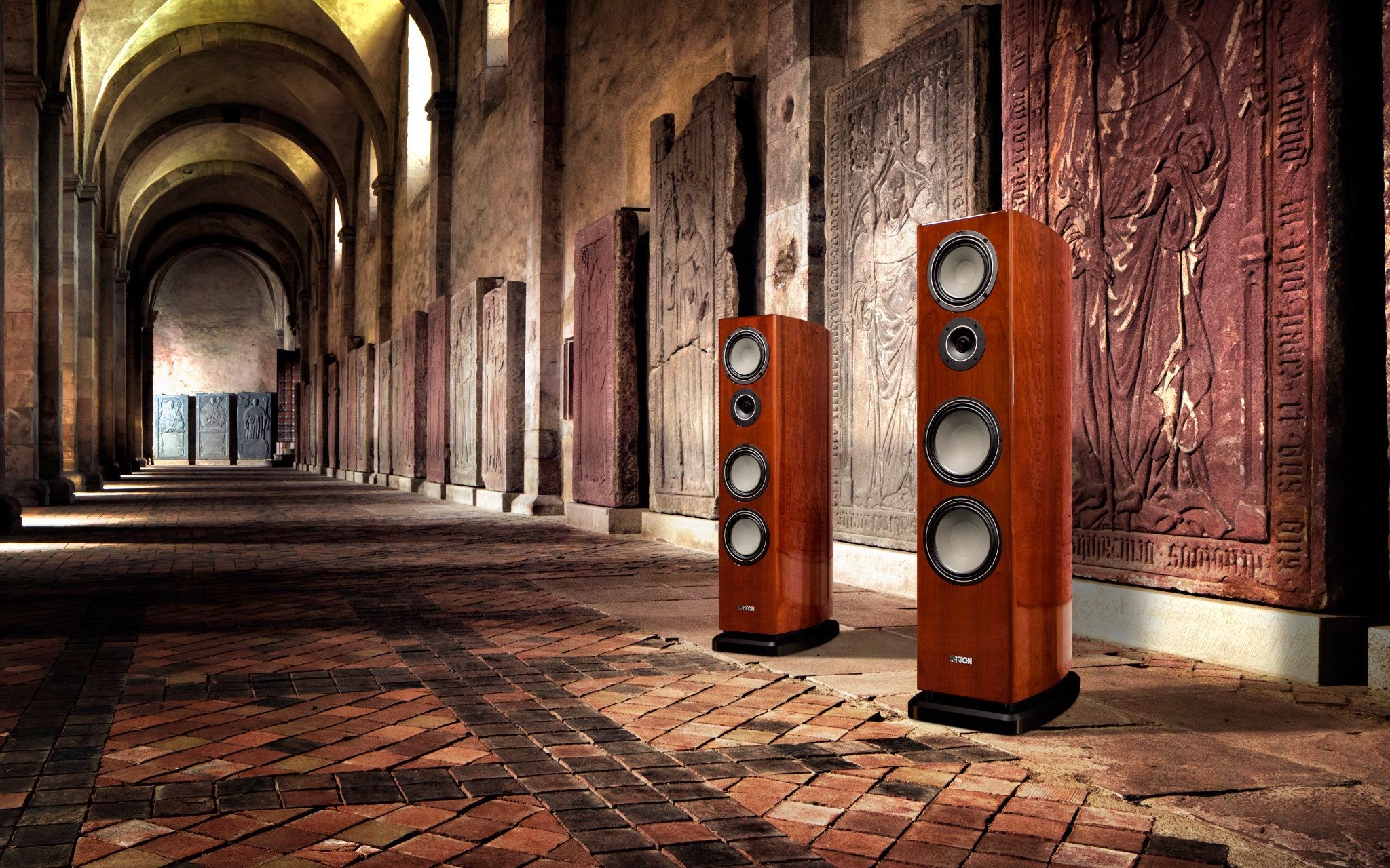 Canton Reference K speakers in cherry finish in cathedral hallway