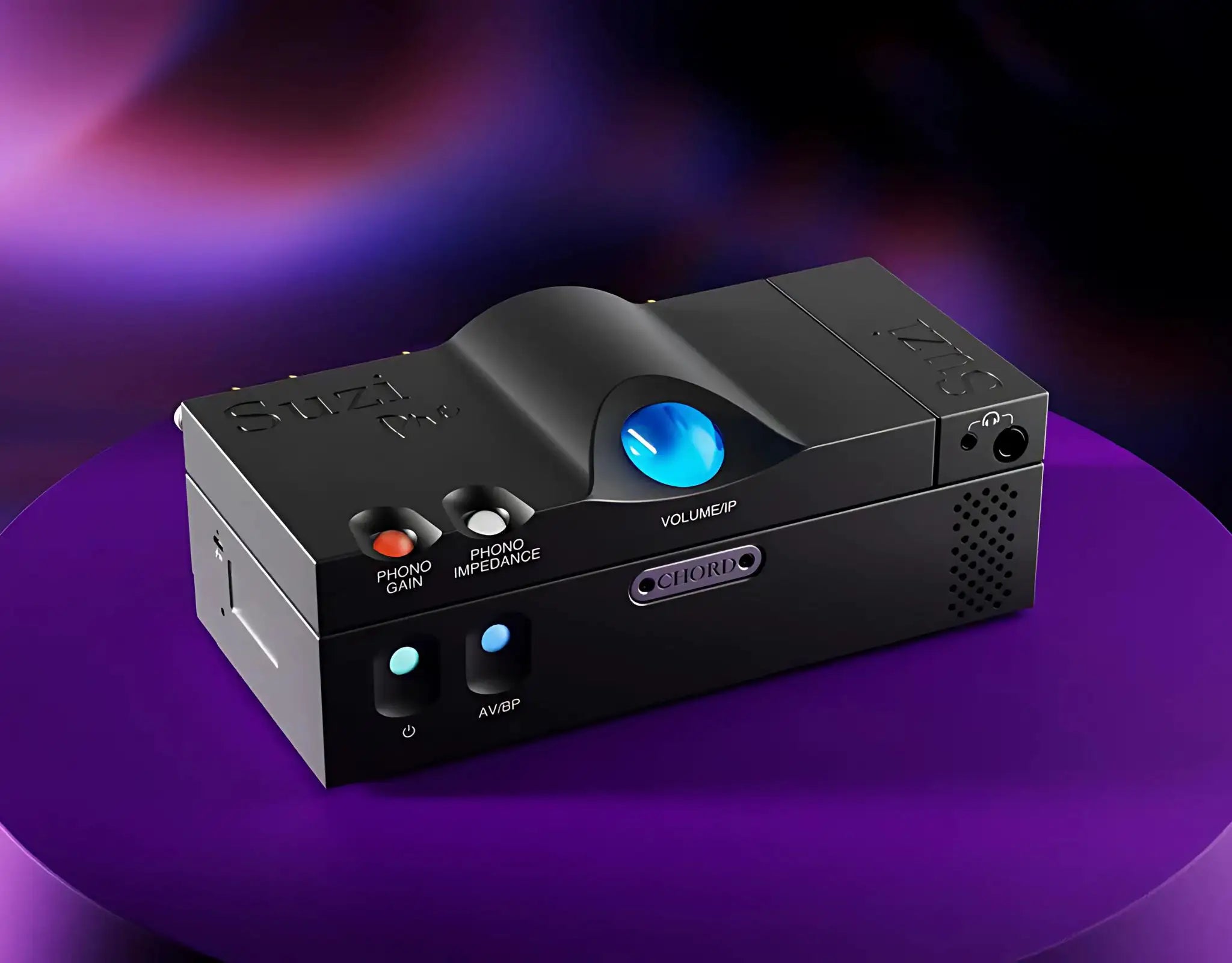 Chord Electronics Suzi Pre preamp on top of Chord Suzi power amp sitting front left 3 quarter angle with purple lighting
