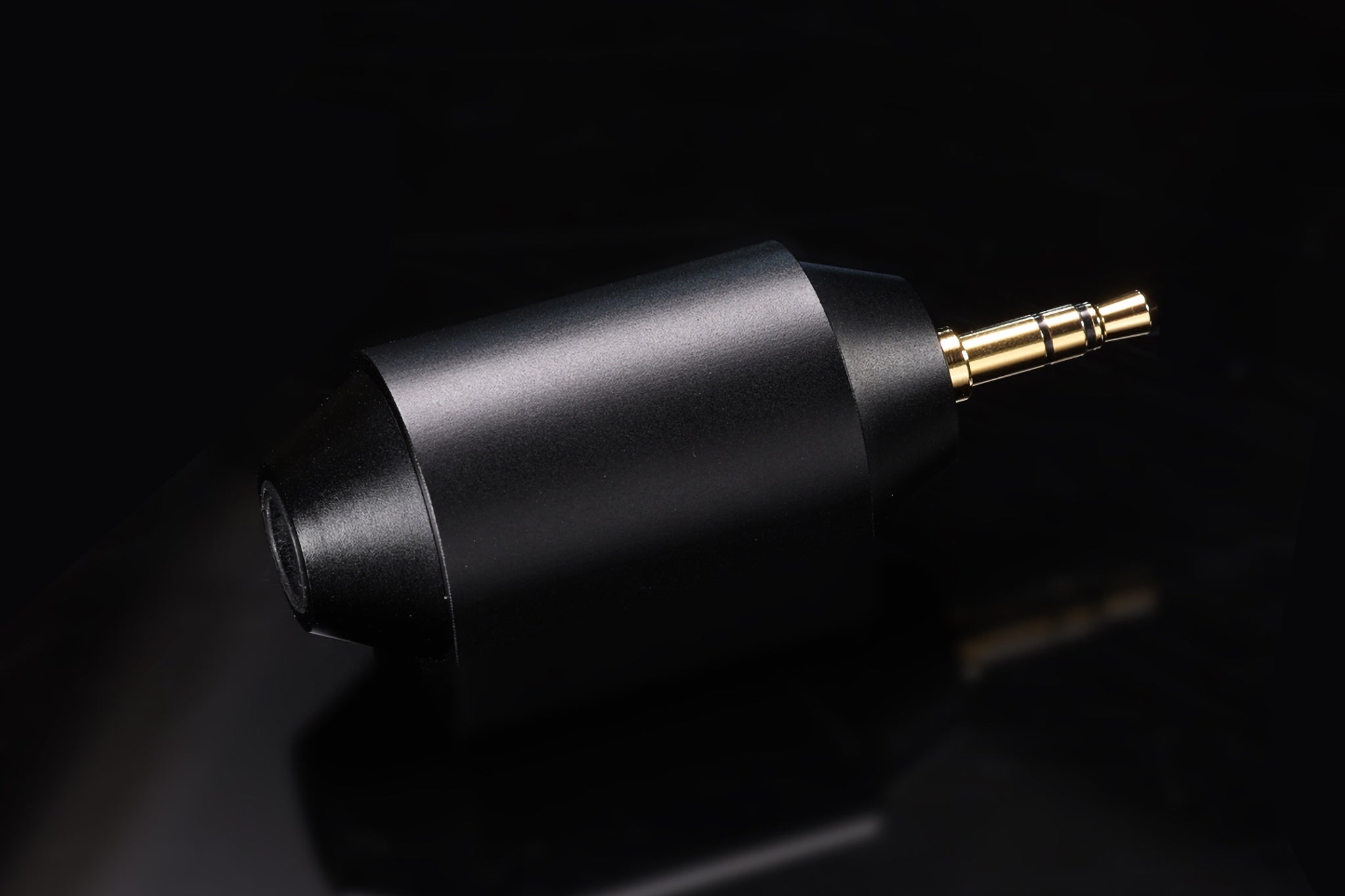 ddHiFi DJ65M adapter over dark reflective background